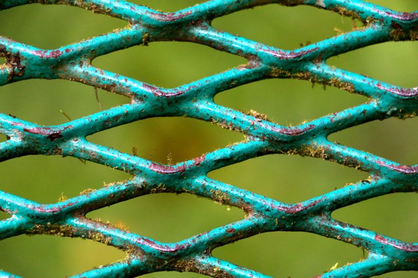 Grating of hanging bridge suspended high-above canyons in Monteverde